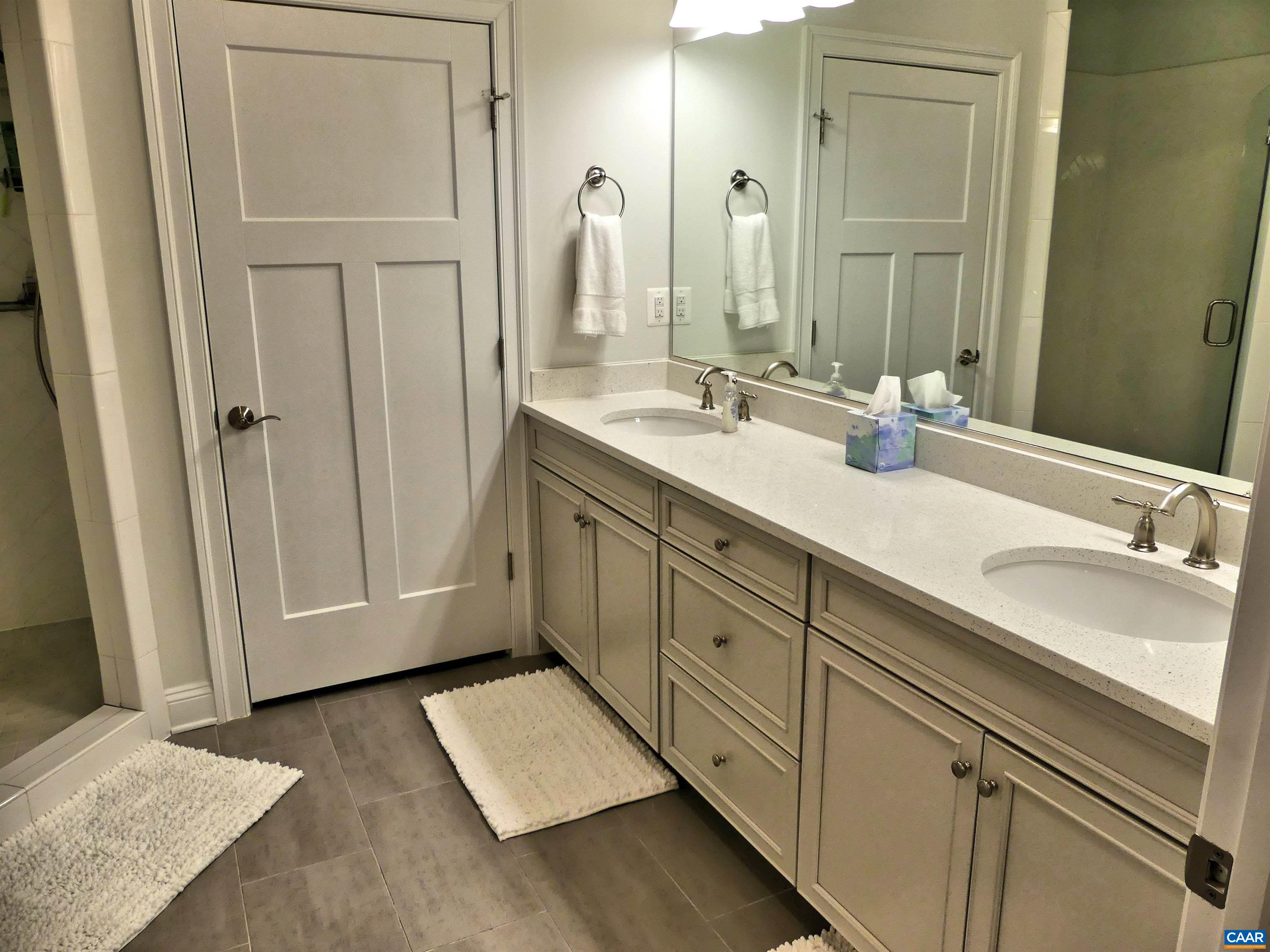1318 Free State Drive Charlottesville, VA 22901 - Photo 24 of 46 a spacious bathroom with a double vanity sink and mirror