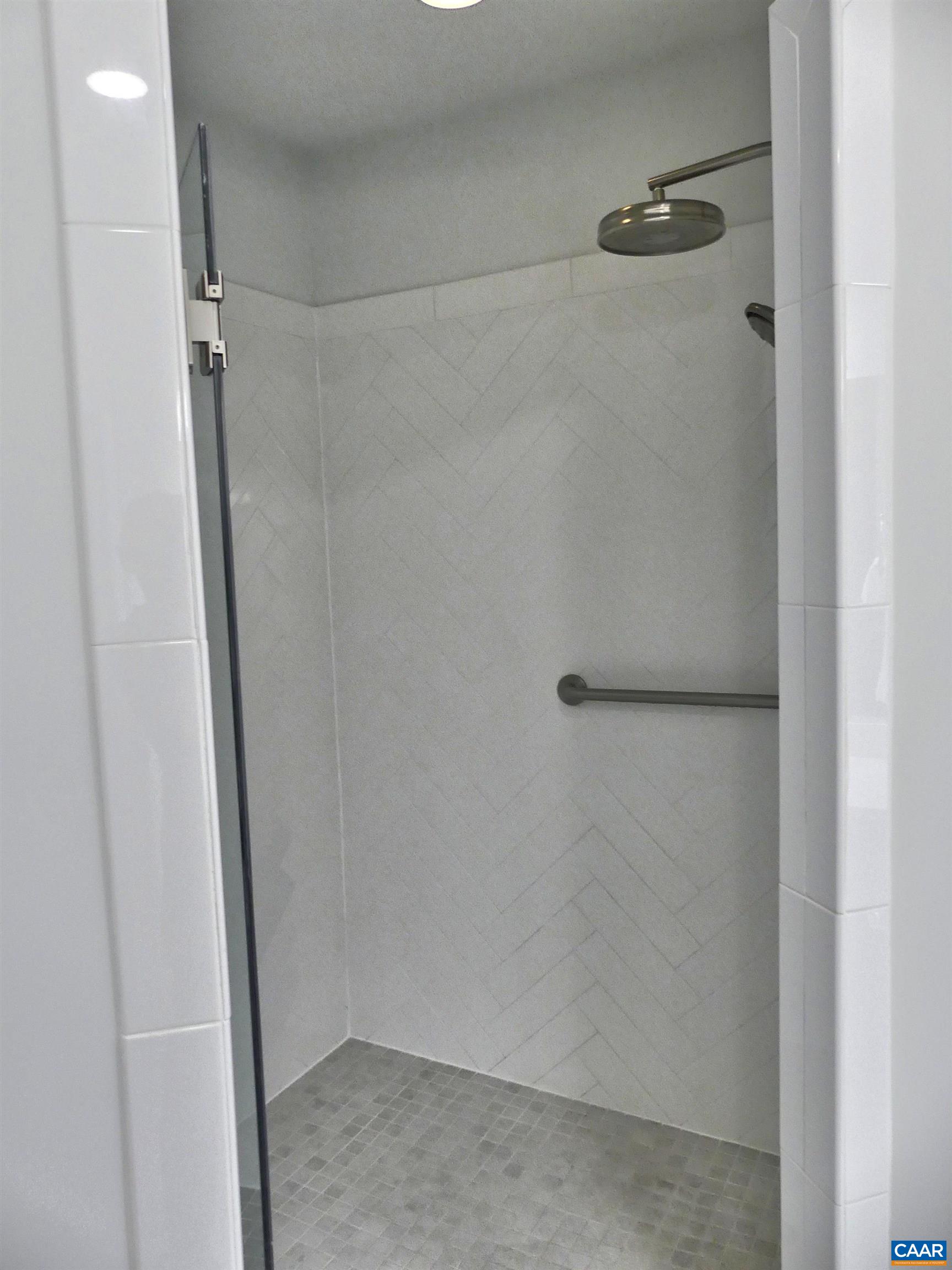1318 Free State Drive Charlottesville, VA 22901 - Photo 25 of 46 a bathroom with a glass shower door