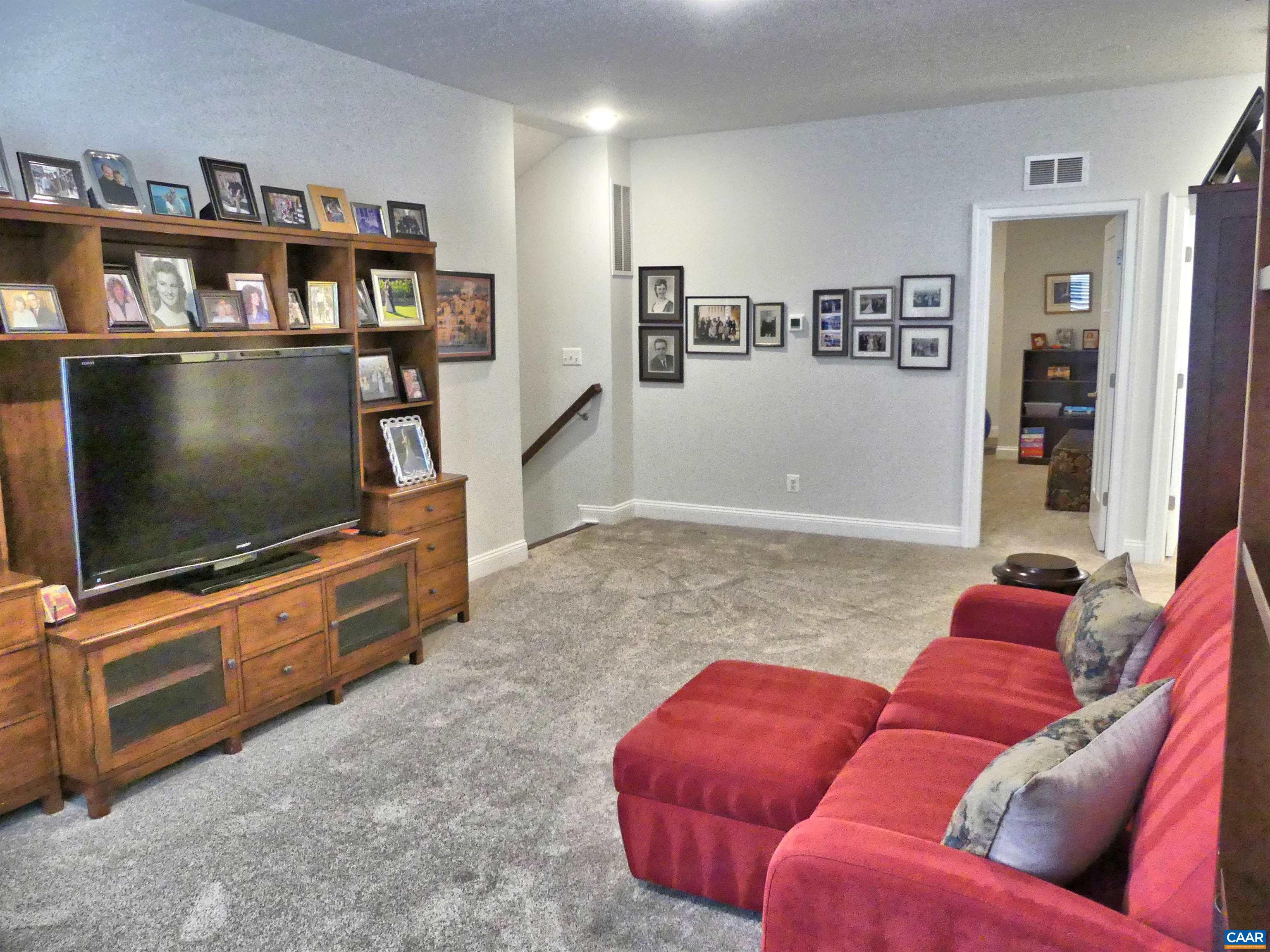 1318 Free State Drive Charlottesville, VA 22901 - Photo 32 of 46 a living room with furniture and a flat screen tv