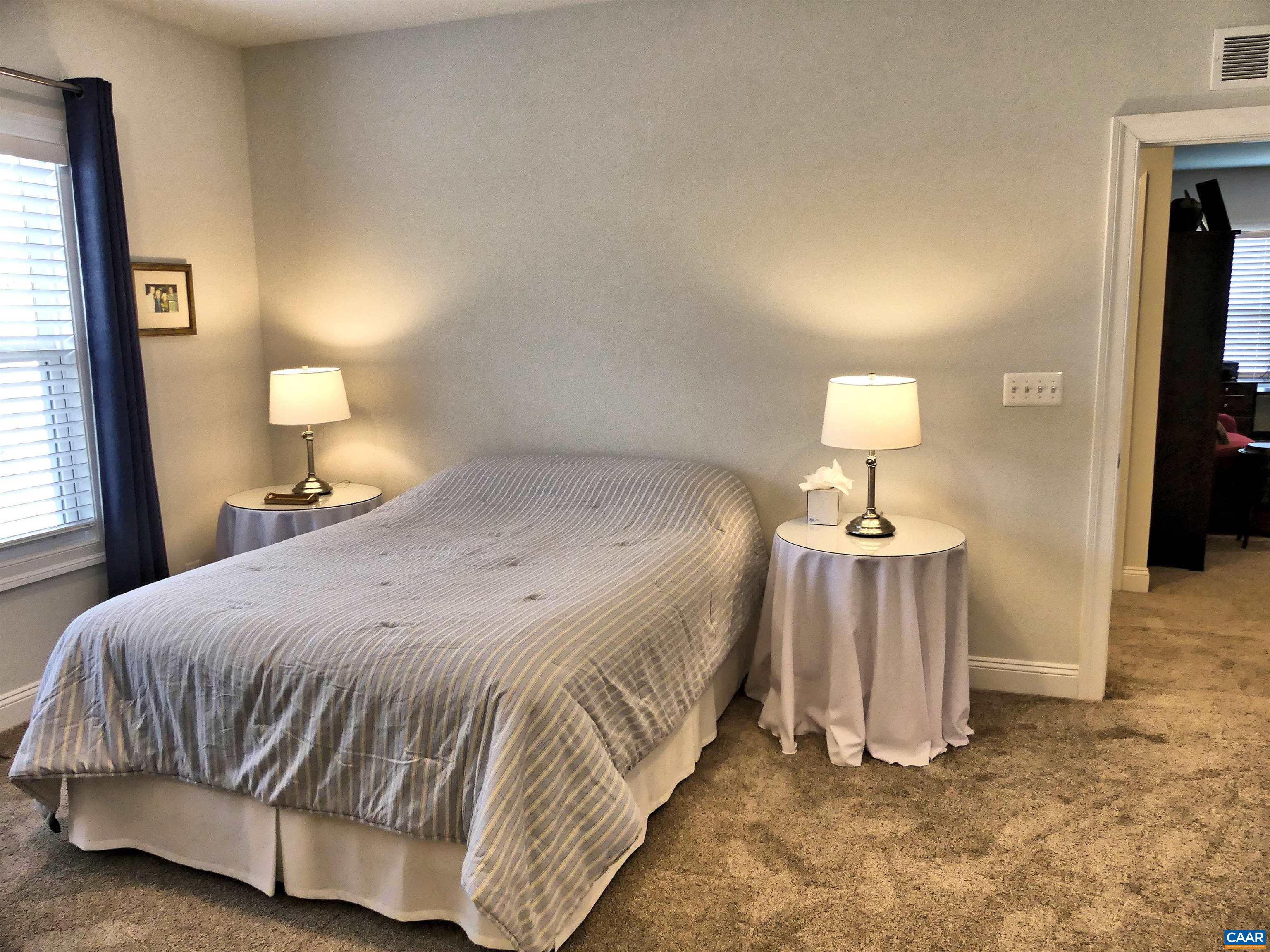 1318 Free State Drive Charlottesville, VA 22901 - Photo 35 of 46 a bedroom with a bed and a lamp