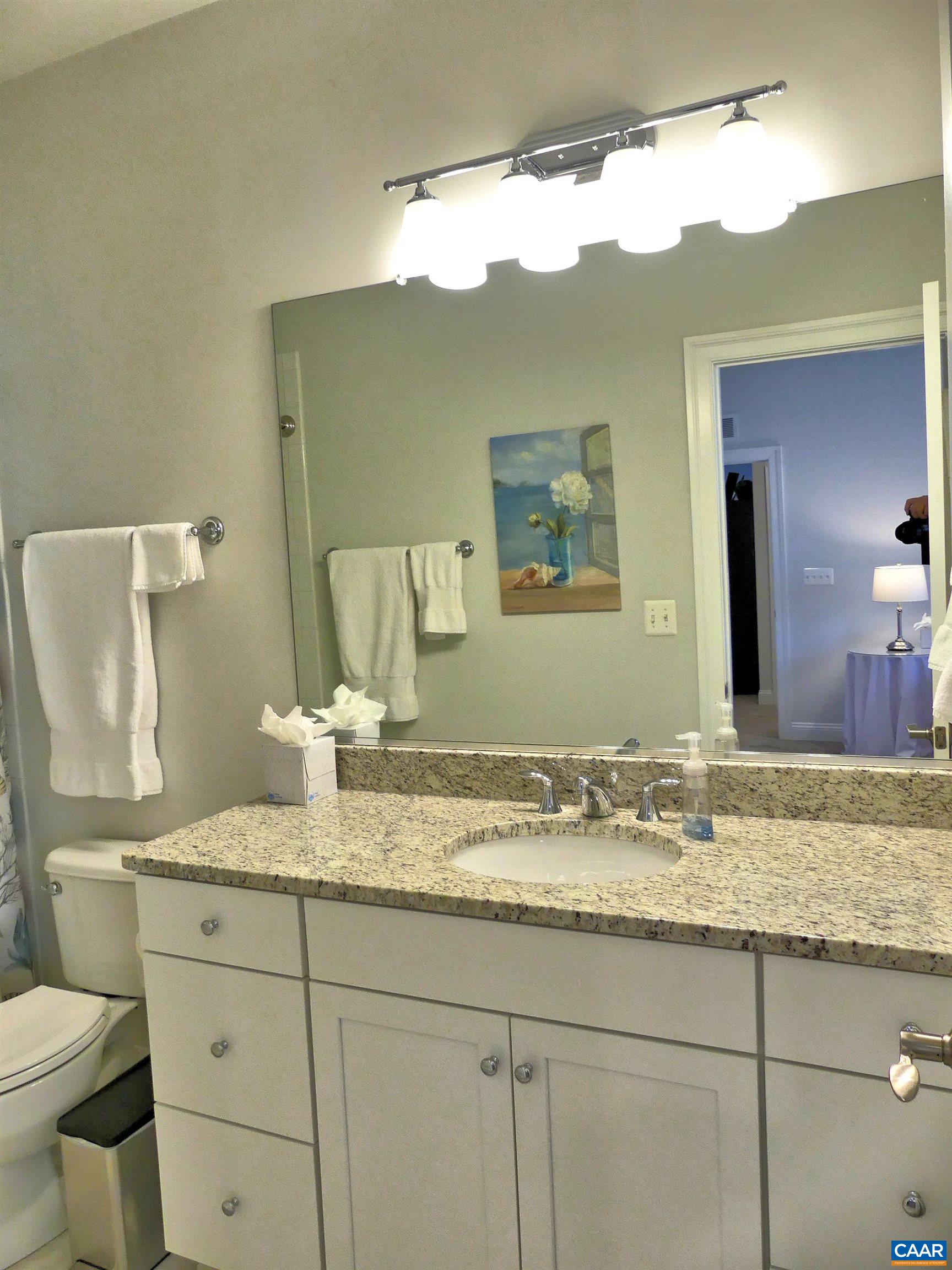 1318 Free State Drive Charlottesville, VA 22901 - Photo 37 of 46 a bathroom with a granite countertop sink and a mirror