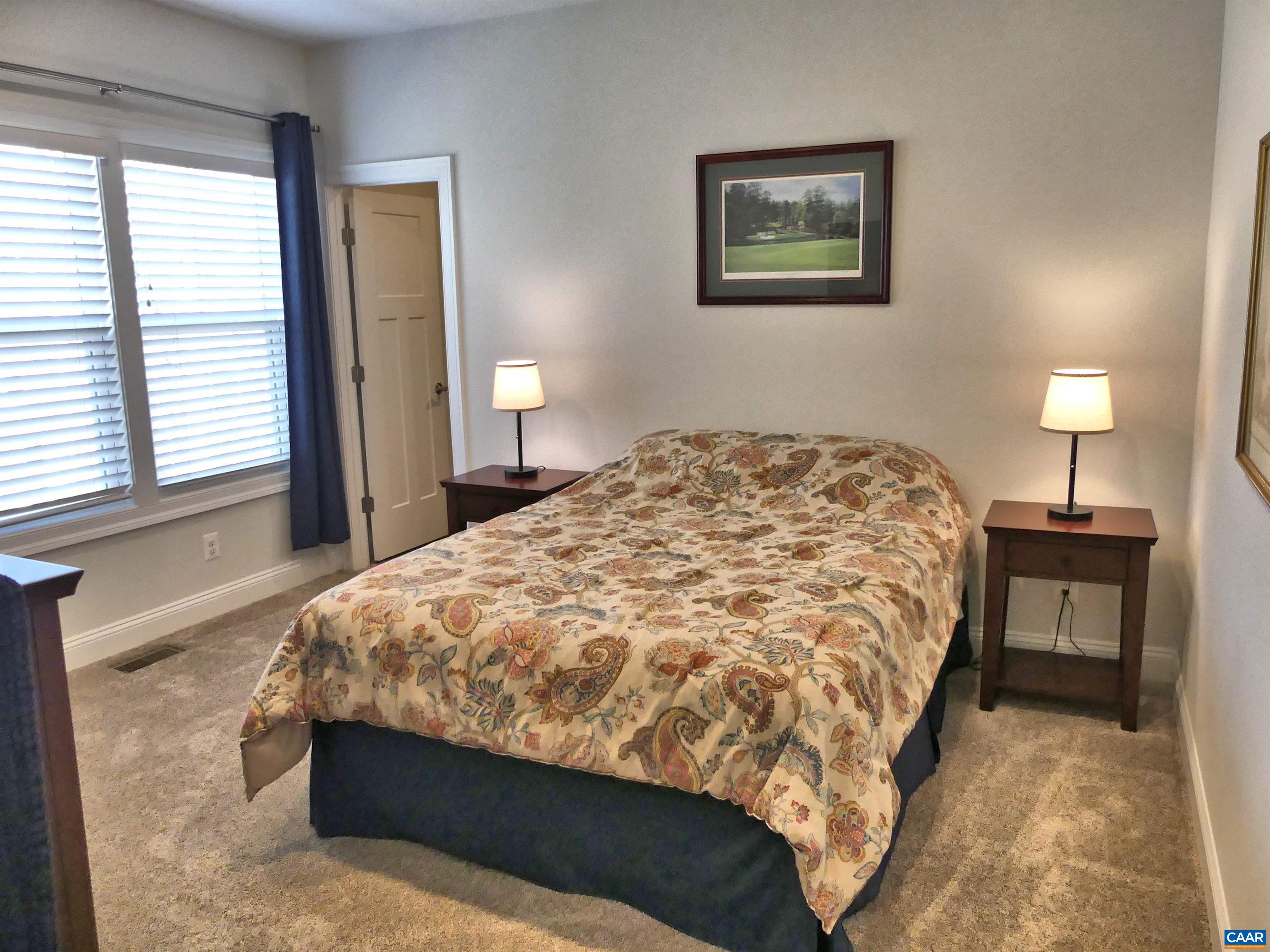 1318 Free State Drive Charlottesville, VA 22901 - Photo 40 of 46 a bedroom with a bed and a lamp