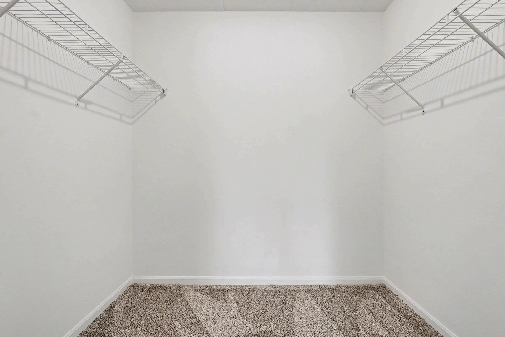 228 East Bailey Road, Unit F Naperville, IL 60565 - Photo 14 of 16 a view of a room with racks on the wall