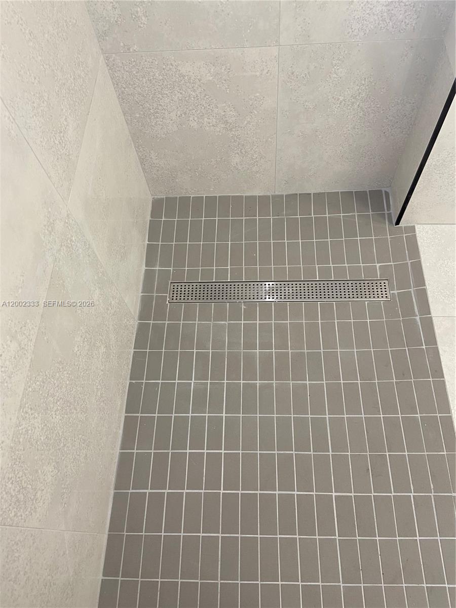 9840 Southwest 69th Avenue Pinecrest, FL 33156 - Photo 13 of 24 a bathroom with a shower