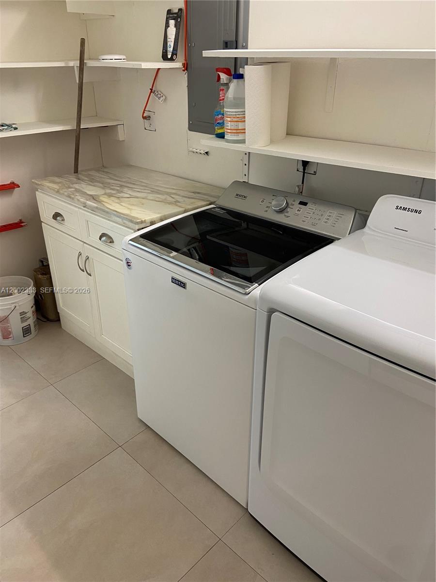 9840 Southwest 69th Avenue Pinecrest, FL 33156 - Photo 16 of 24 a utility room with dryer and washer