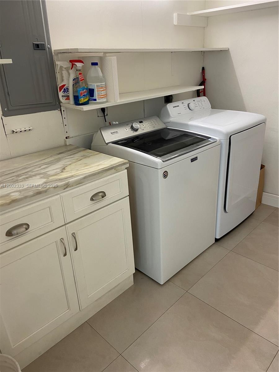 9840 Southwest 69th Avenue Pinecrest, FL 33156 - Photo 17 of 24 a utility room with dryer and washer