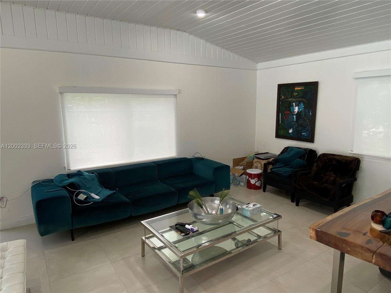 9840 Southwest 69th Avenue Pinecrest, FL 33156 - Photo 21 of 24 a living room with furniture and a couch
