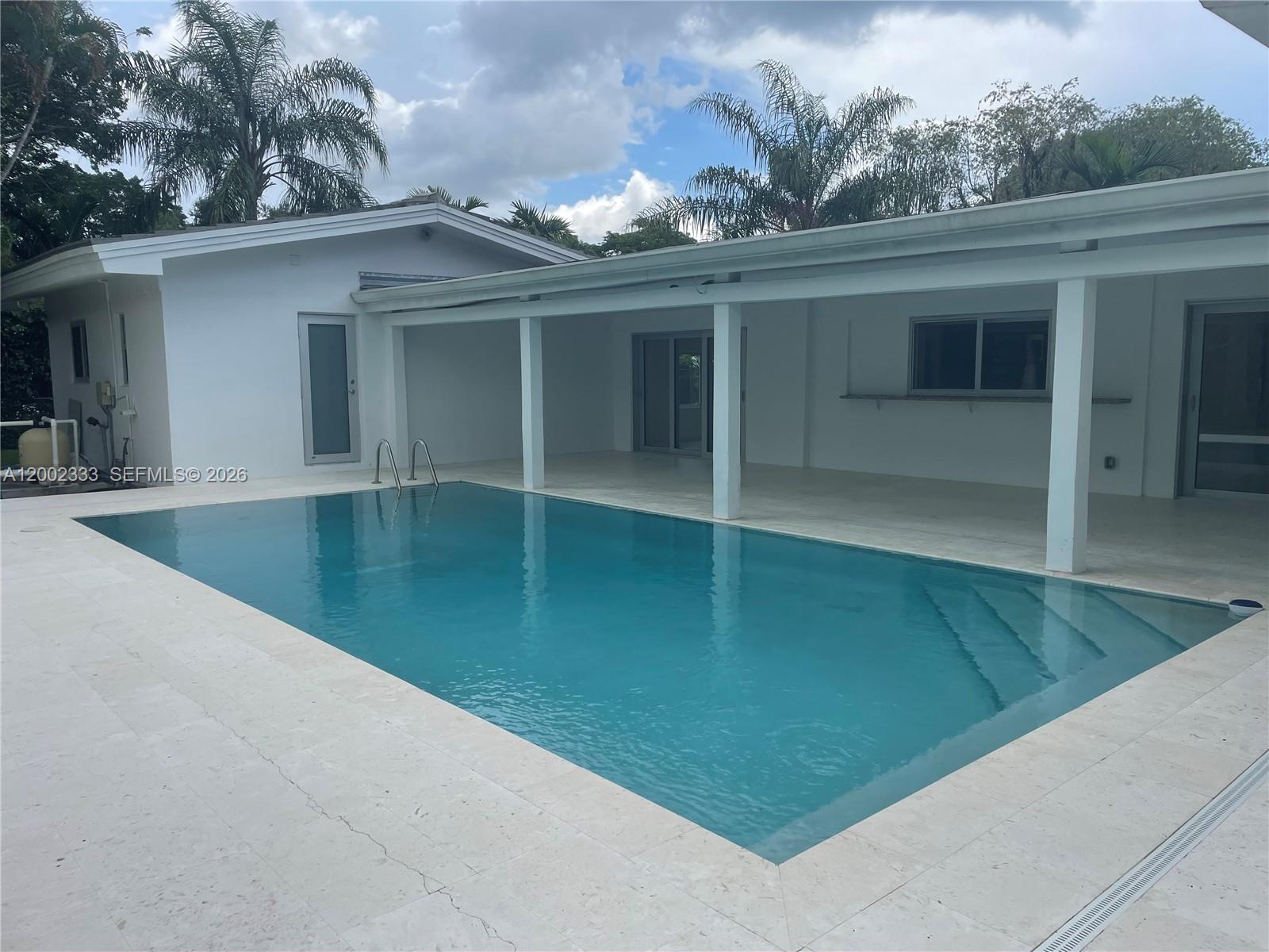 9840 Southwest 69th Avenue Pinecrest, FL 33156 - Photo 5 of 24 an outdoor view of house