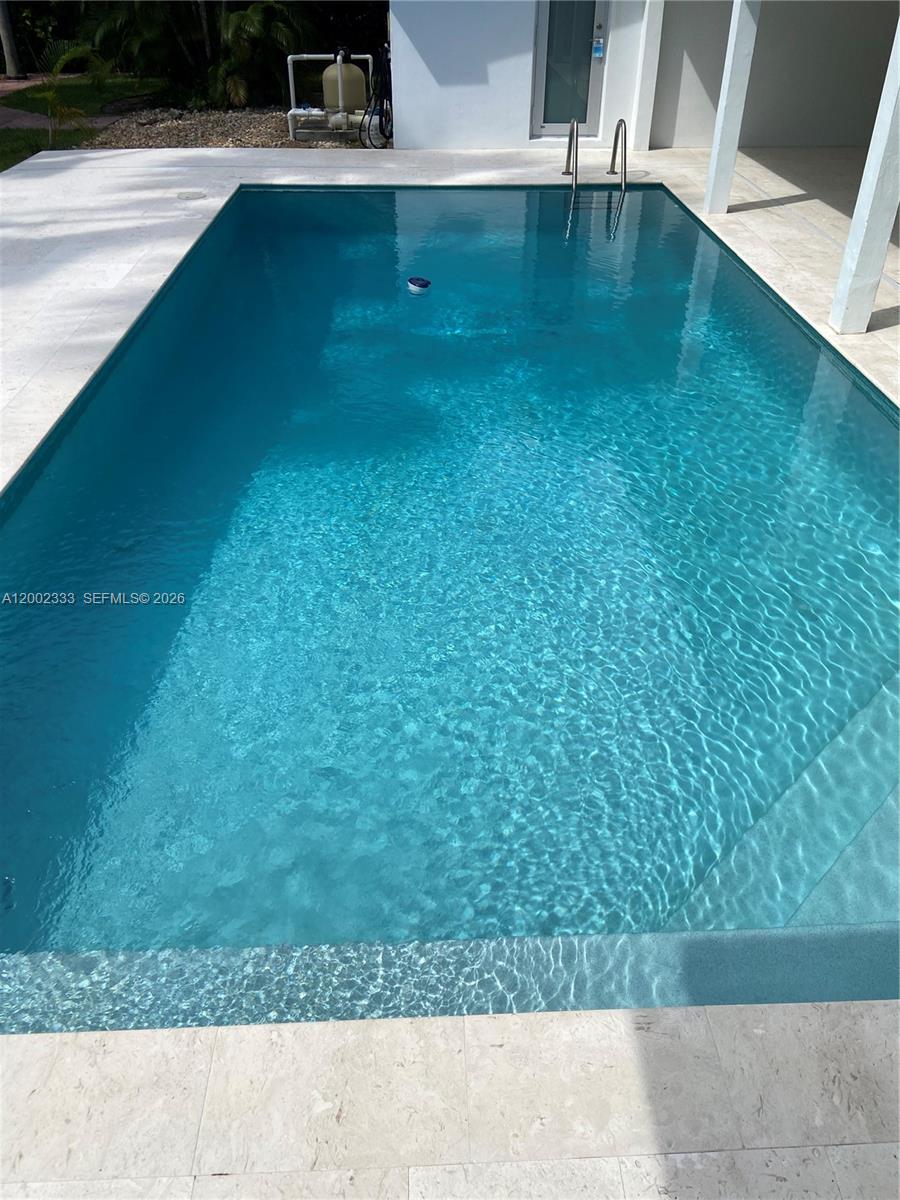 9840 Southwest 69th Avenue Pinecrest, FL 33156 - Photo 6 of 24 a view of a backyard