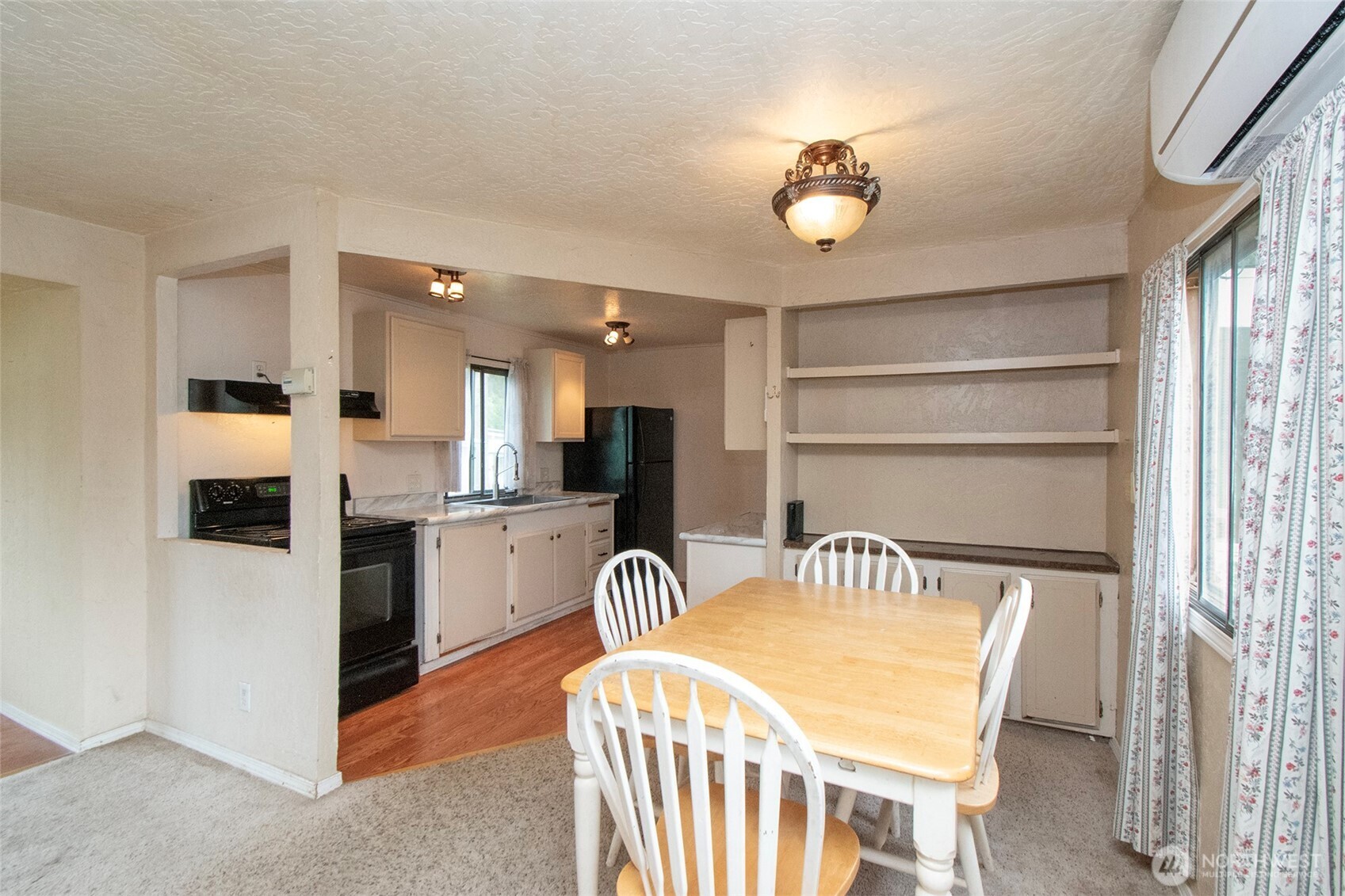 90 Baywood Village Road, Unit 34 Sequim, WA 98382 - Photo 13 of 40 a kitchen with a refrigerator and a sink