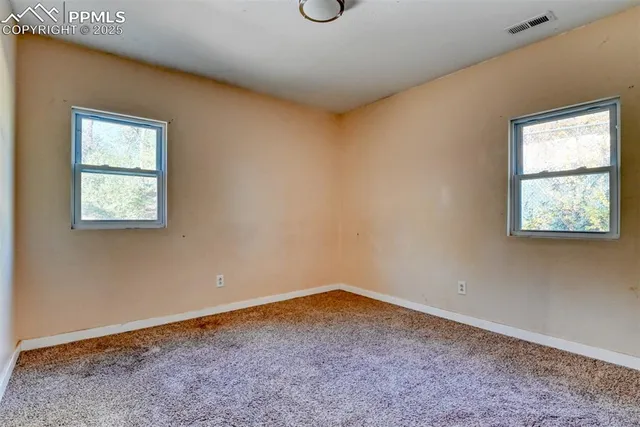 an empty room with windows