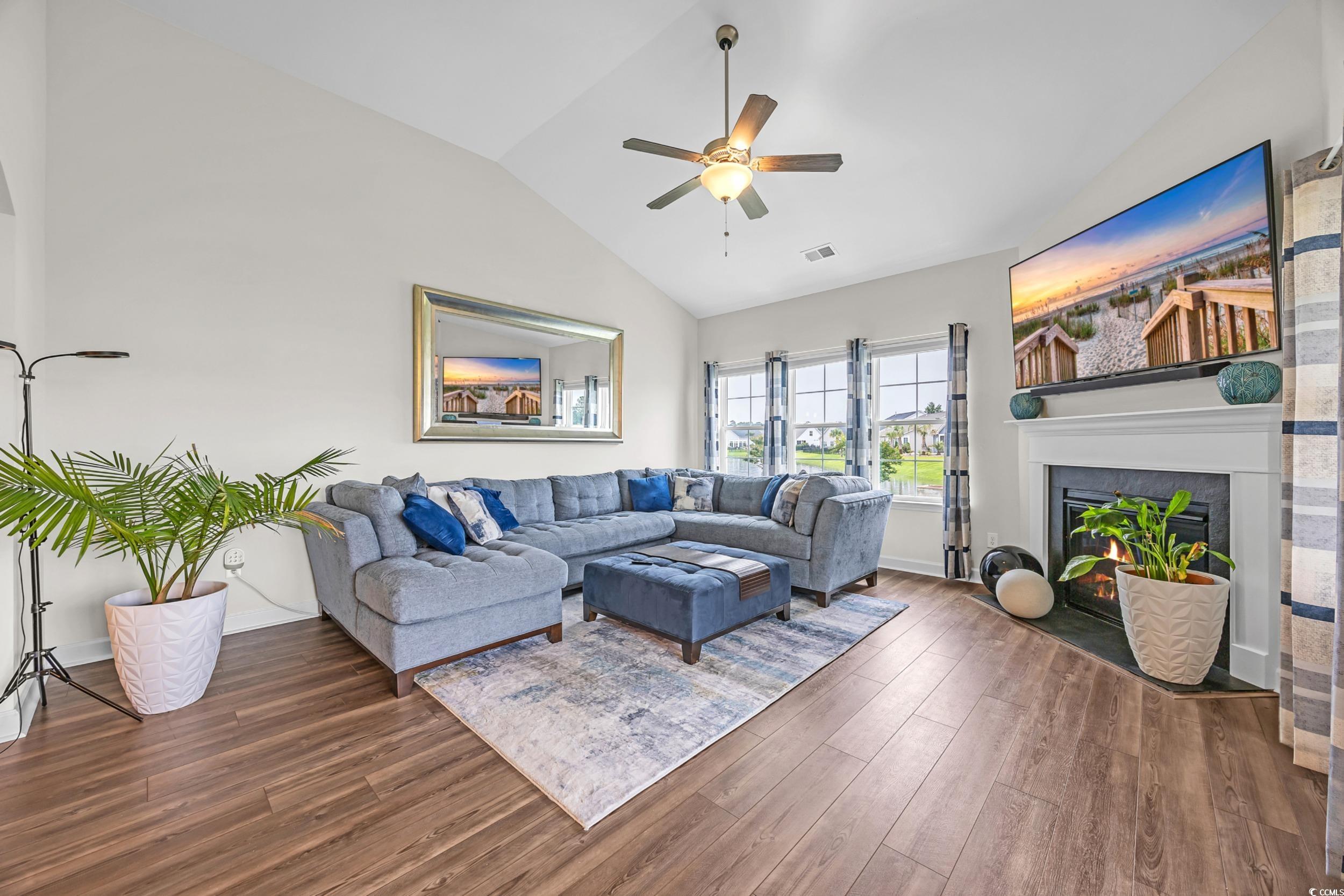 116 Glengrove Lane Murrells Inlet, SC 29576 - Photo 11 of 28 Dining space with arched walkways, a chandelier and vaulted ceiling
