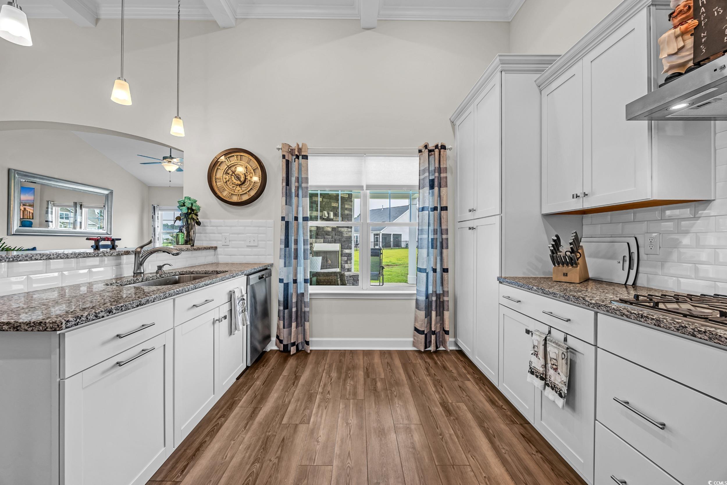 116 Glengrove Lane Murrells Inlet, SC 29576 - Photo 14 of 28 Living room featuring lofted ceiling, ceiling fan, a glass covered fireplace, and baseboards