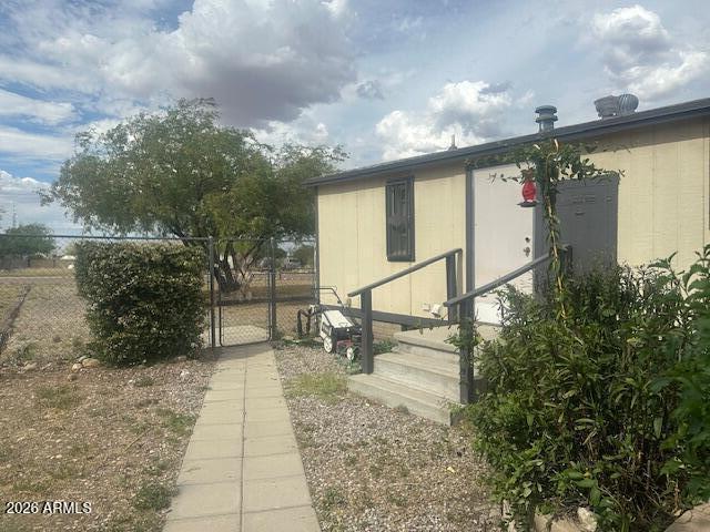 7258 South Lariat Road Hereford, AZ 85615 - Photo 32 of 37 a front view of a house with a yard