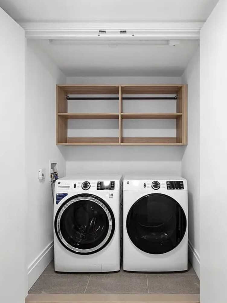 50 West 66th Street, Unit 7G Manhattan, NY 10023 - Photo 16 of 21 a utility room with dryer and washer