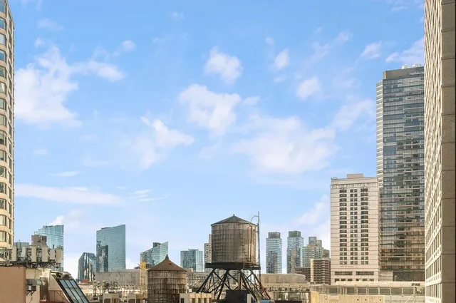 a kitchen with stainless steel appliances a refrigerator sink and stove