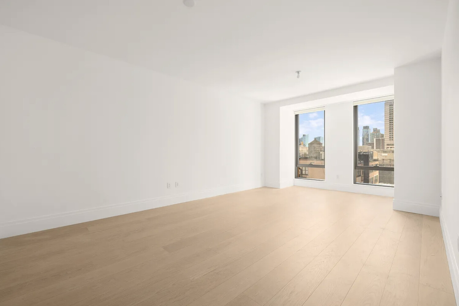 50 West 66th Street, Unit 7G Manhattan, NY 10023 - Photo 20 of 21 an empty room with windows