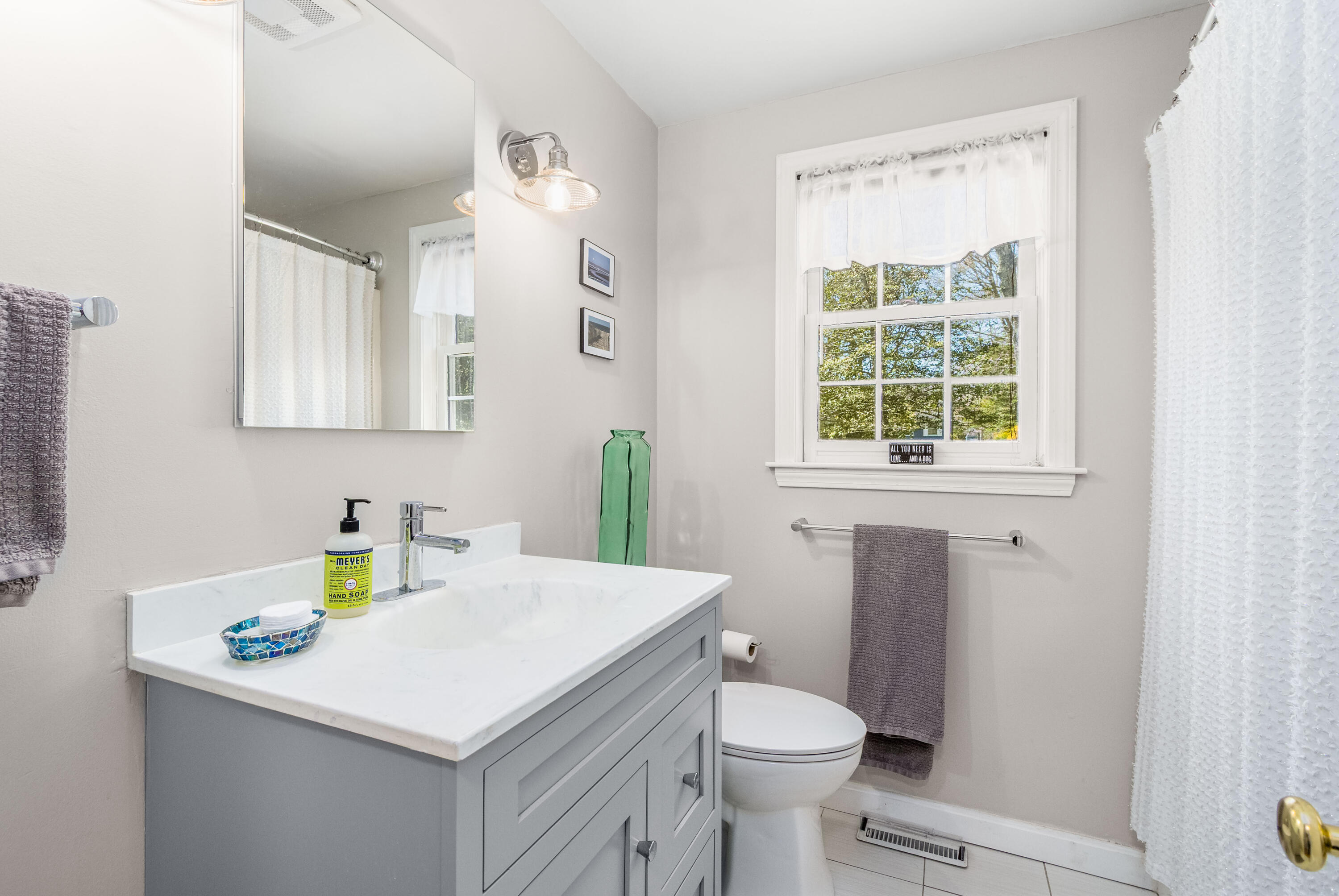5 Raspberry Lane Marstons Mills, MA 02648 - Photo 12 of 29 a bathroom with a sink a toilet and a window