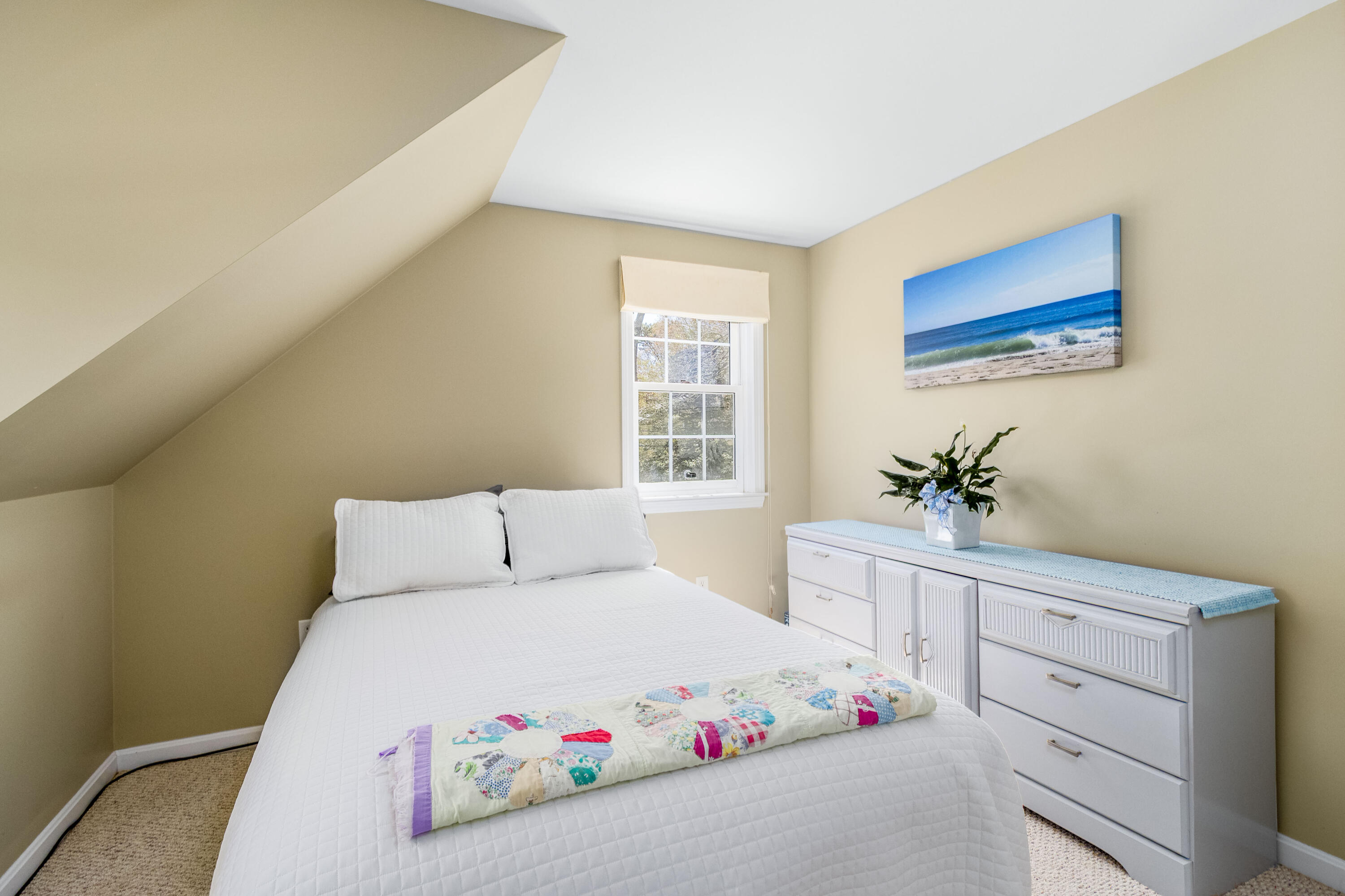 5 Raspberry Lane Marstons Mills, MA 02648 - Photo 16 of 29 a bedroom with a bed and a potted plant