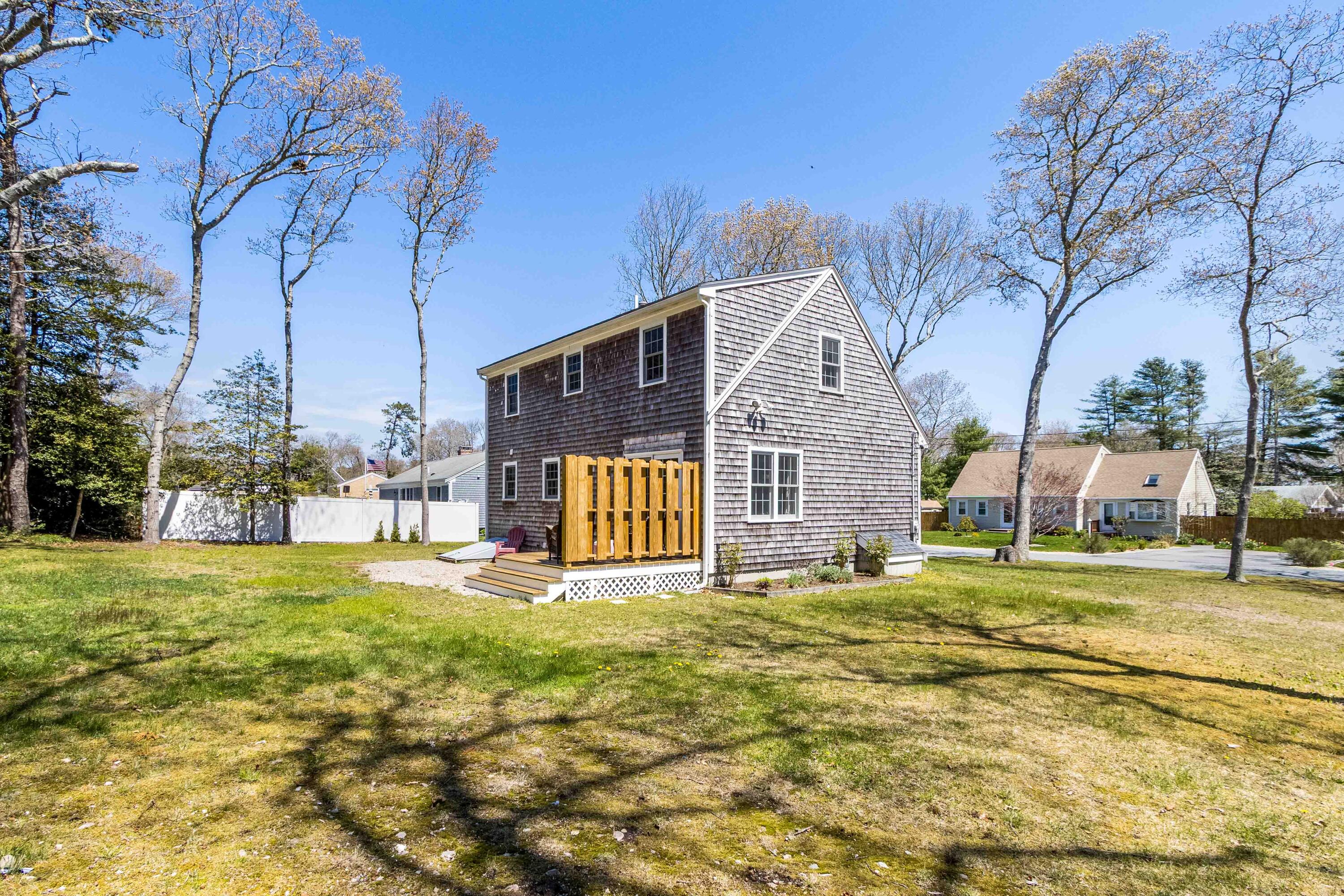 5 Raspberry Lane Marstons Mills, MA 02648 - Photo 23 of 29 a view of a house with a big yard and large trees