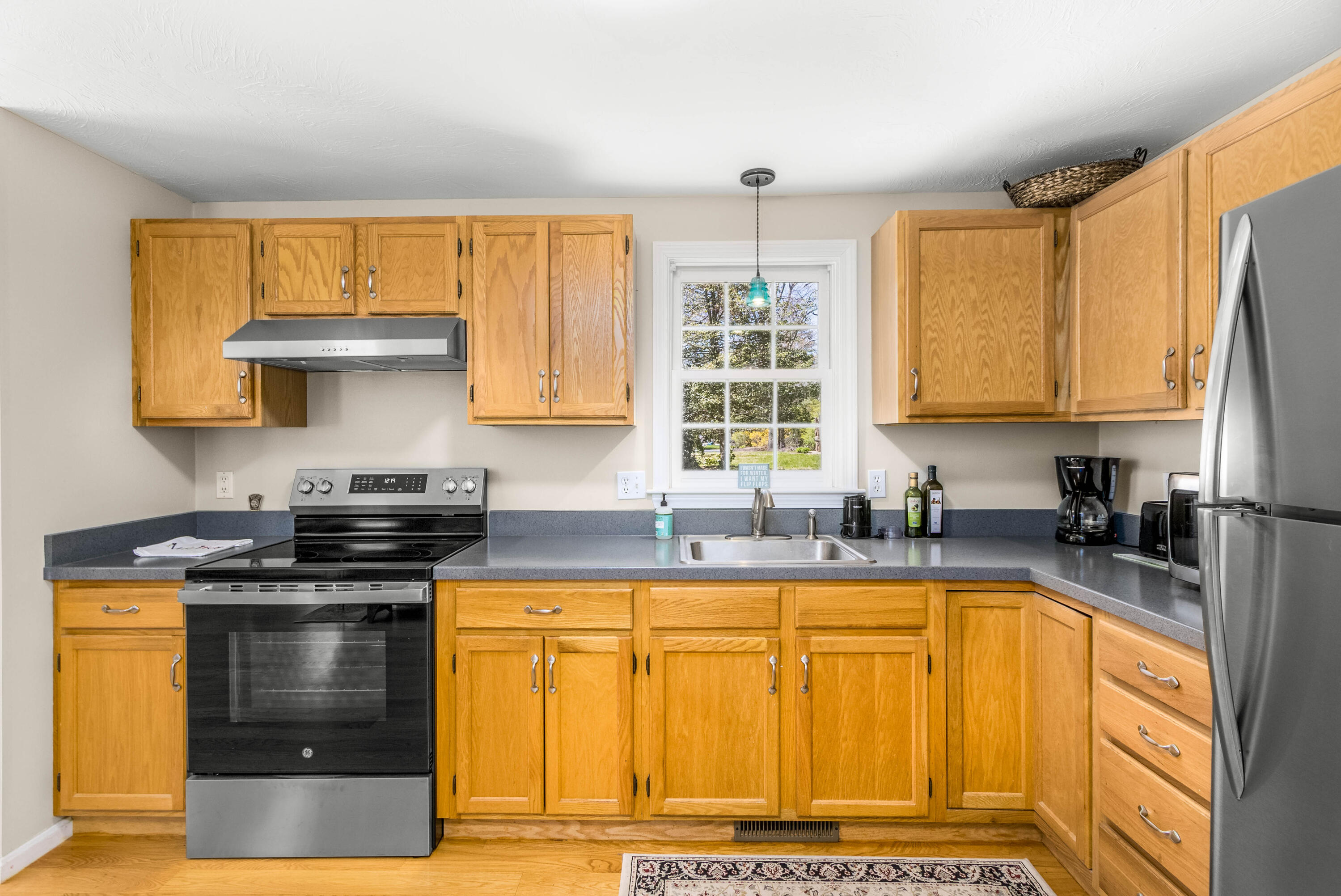 5 Raspberry Lane Marstons Mills, MA 02648 - Photo 8 of 29 a kitchen with stainless steel appliances granite countertop a stove a sink and a microwave