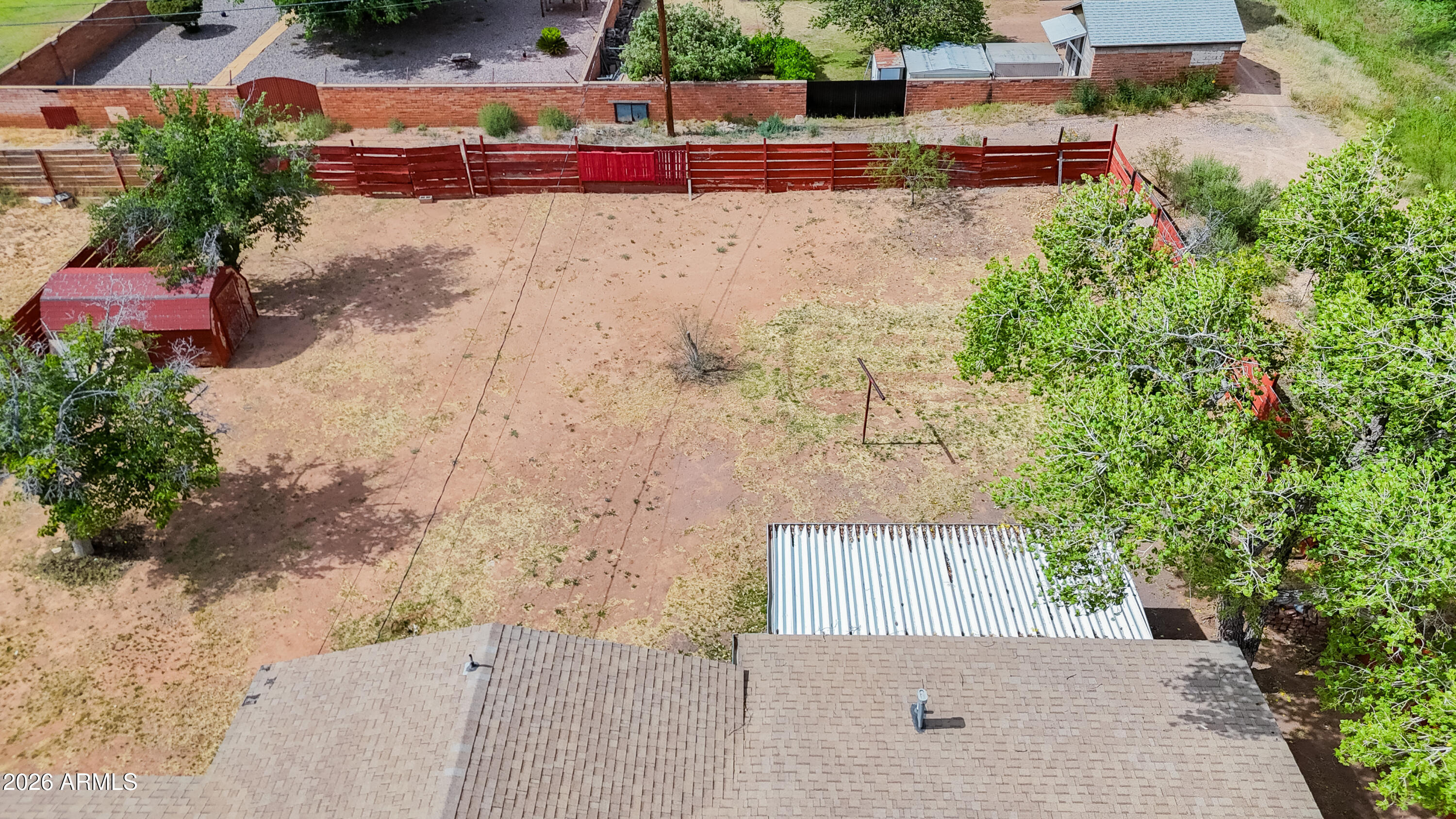 1626 11th Street Douglas, AZ 85607 - Photo 29 of 30 an aerial view of a house with a yard and large tree