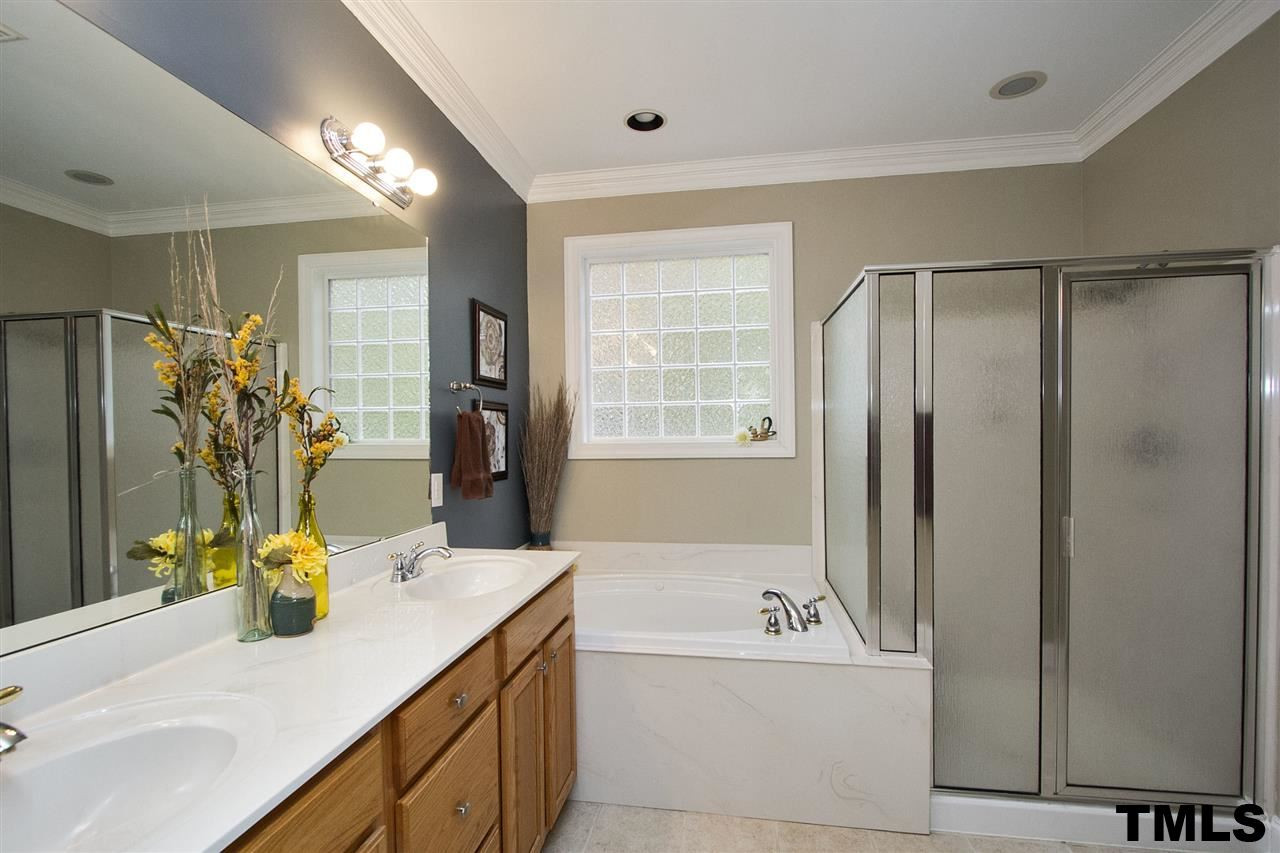 2012 Waterbrook Court Raleigh, NC 27603 - Photo 9 of 25 This picture does not do the bathroom justice. Features include: Whirlpool Tub, His and Hers Closets, Water Closet, Linen Closet, Dual Sinks, Tile Floor! Master Bath/Spa