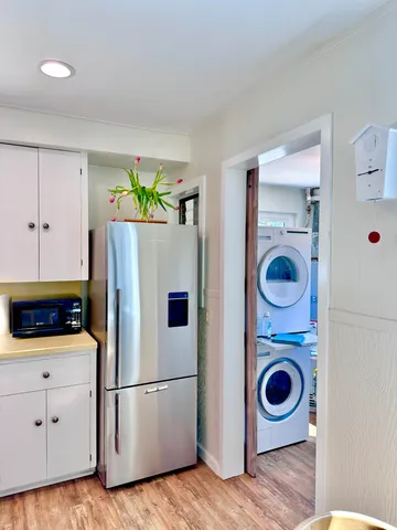 a white refrigerator freezer sitting inside of a kitchen