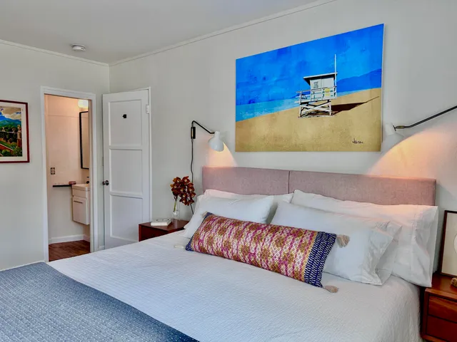 a bedroom with a bed and dresser