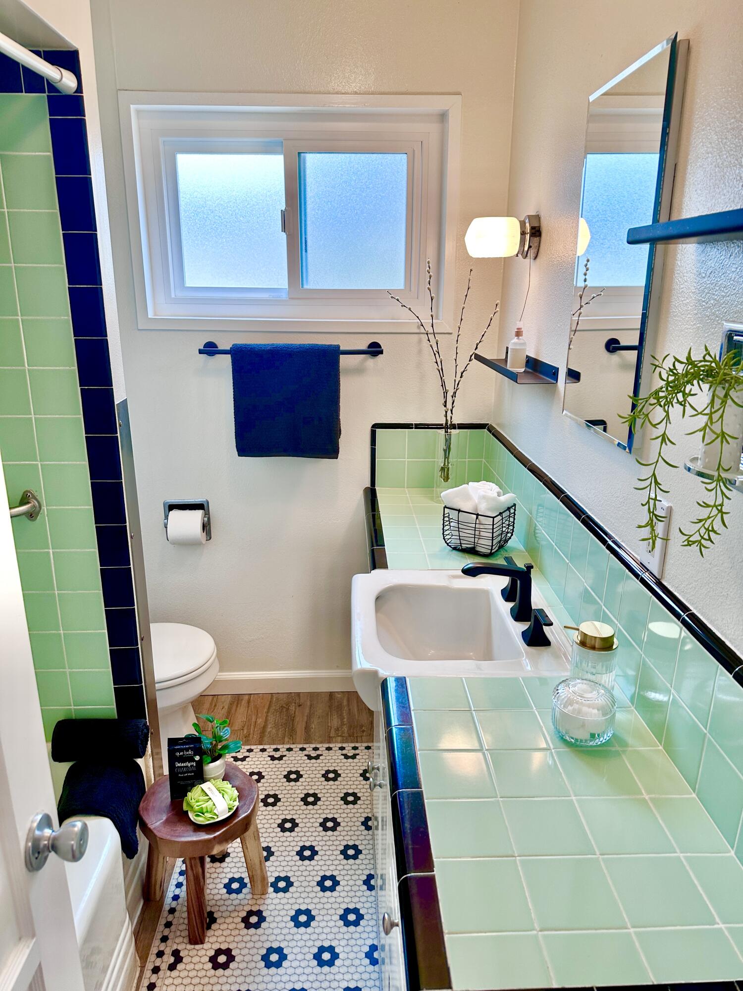 2227 Cliff Drive Santa Barbara, CA 93109 - Photo 14 of 26 a bathroom with a sink a toilet and mirror
