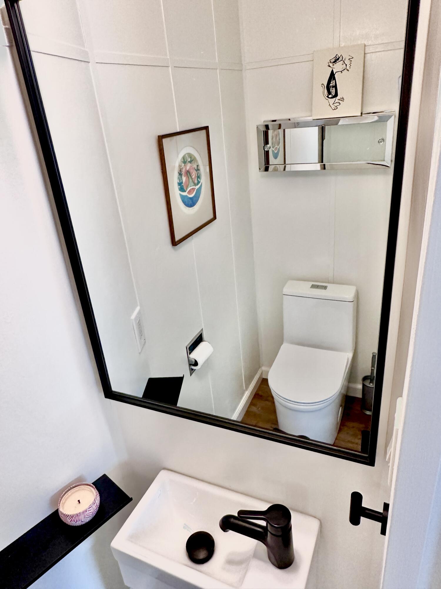2227 Cliff Drive Santa Barbara, CA 93109 - Photo 17 of 26 a bathroom with a toilet and a mirror
