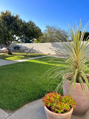 a view of a swimming pool with a yard