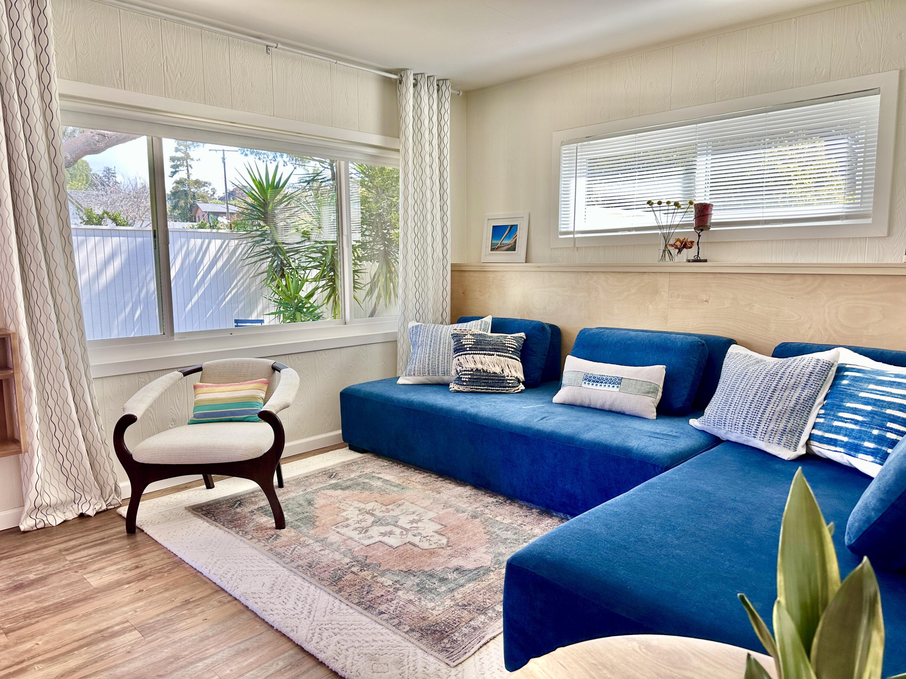 2227 Cliff Drive Santa Barbara, CA 93109 - Photo 8 of 26 a living room with furniture and a large window
