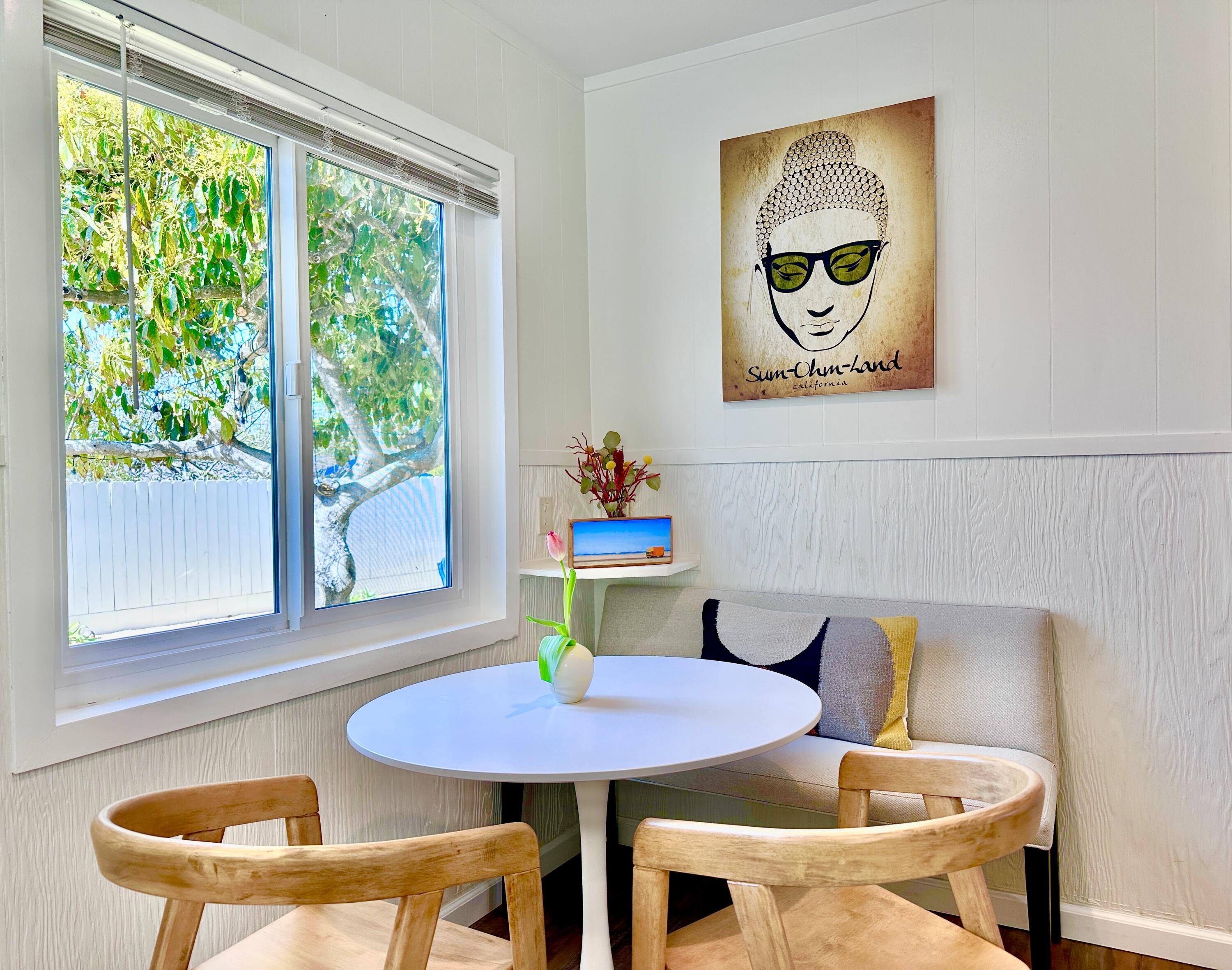 2227 Cliff Drive Santa Barbara, CA 93109 - Photo 9 of 26 a view of a dining room with furniture and a window