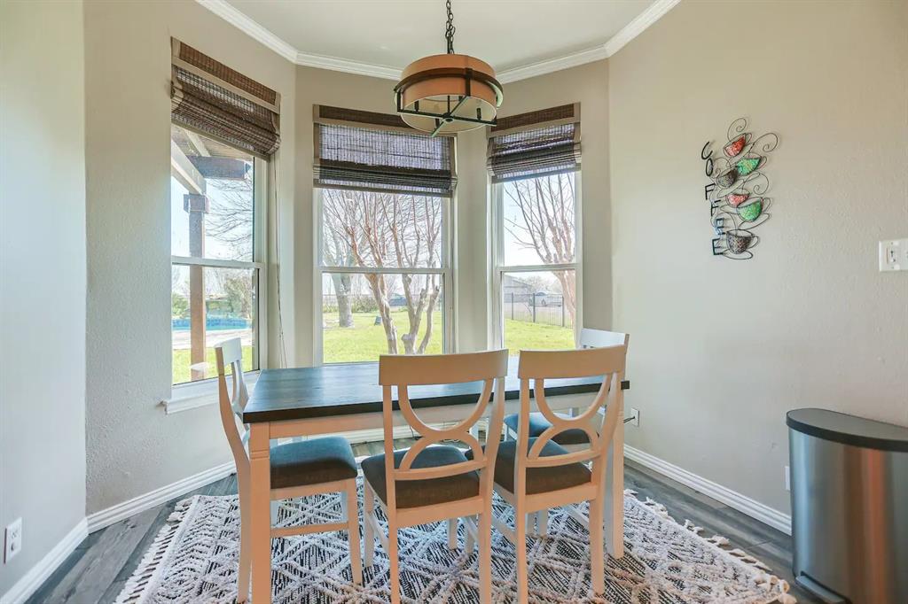 2045 Weston Road McKinney, TX 75071 - Photo 14 of 40 a dining room with furniture and window