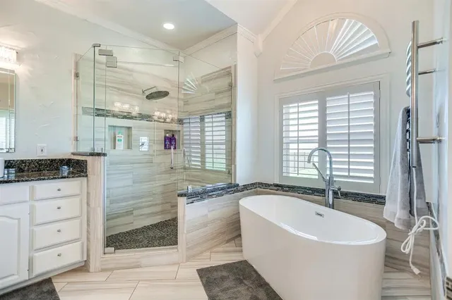 a bathroom with a bathtub and a sink