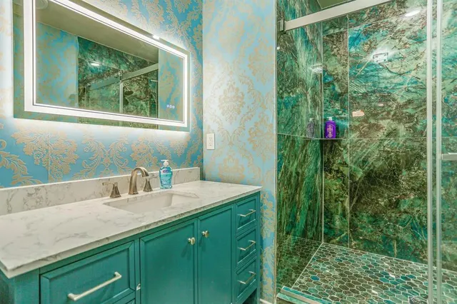 a bathroom with a sink and a mirror