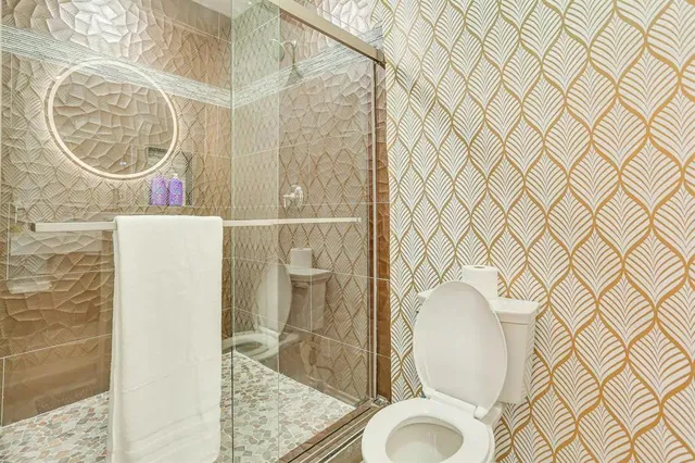 a bathroom with a toilet and a sink