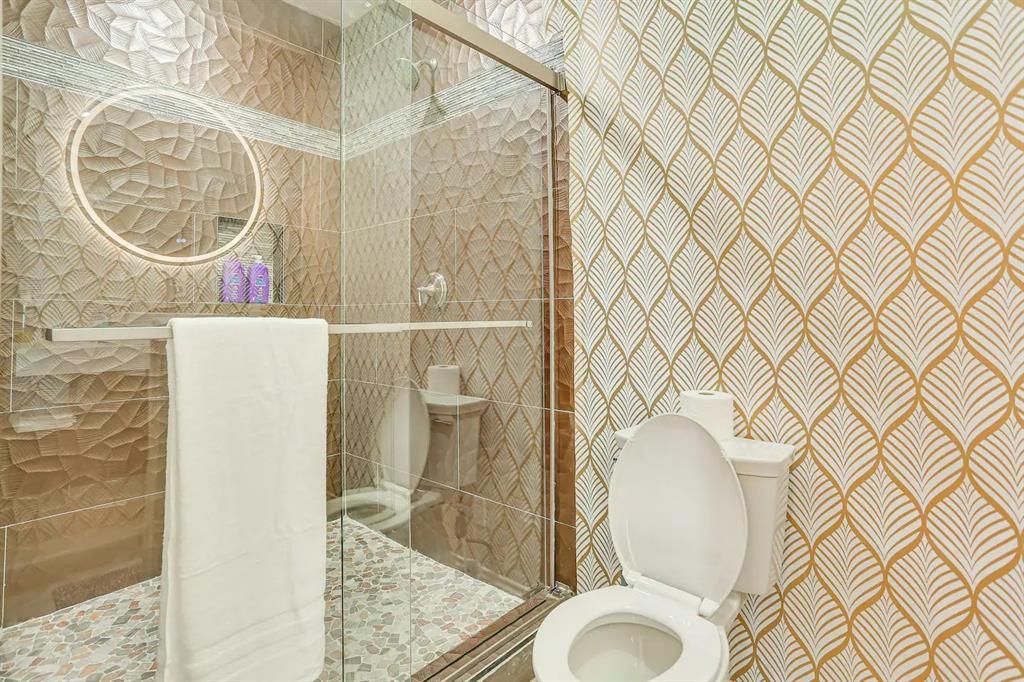 2045 Weston Road McKinney, TX 75071 - Photo 19 of 40 a bathroom with a toilet and a sink