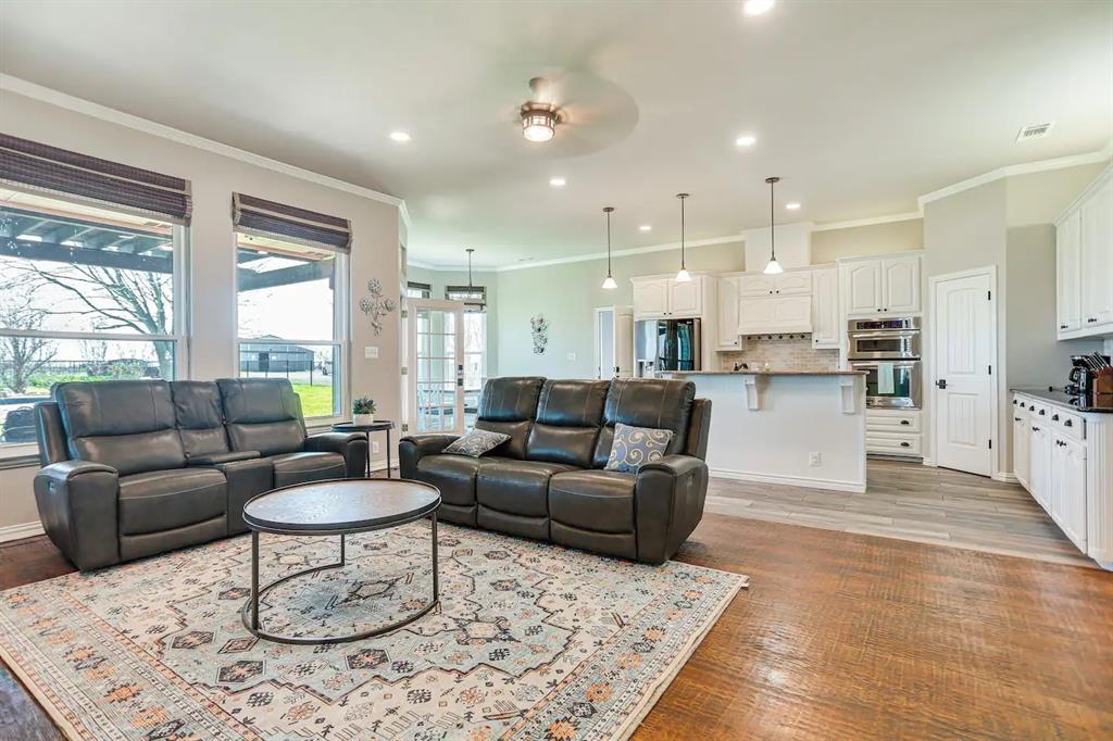 2045 Weston Road McKinney, TX 75071 - Photo 2 of 40 a living room with furniture and a large window
