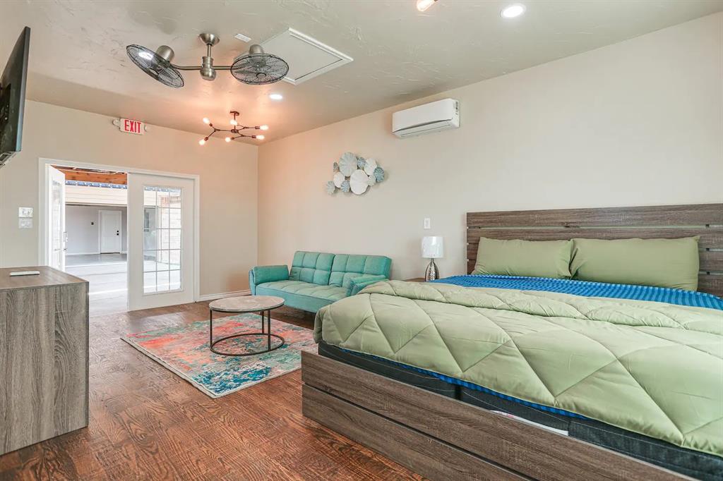 2045 Weston Road McKinney, TX 75071 - Photo 23 of 40 a bedroom with a bed ceiling fan and a window