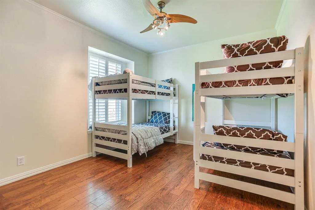 2045 Weston Road McKinney, TX 75071 - Photo 27 of 40 a bedroom with a bed and a window