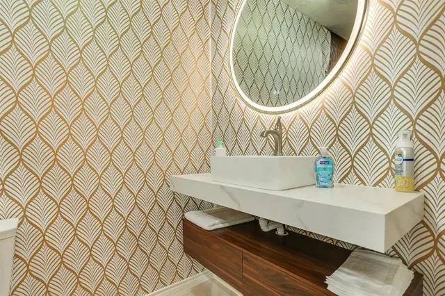 a bathroom with a sink and a mirror