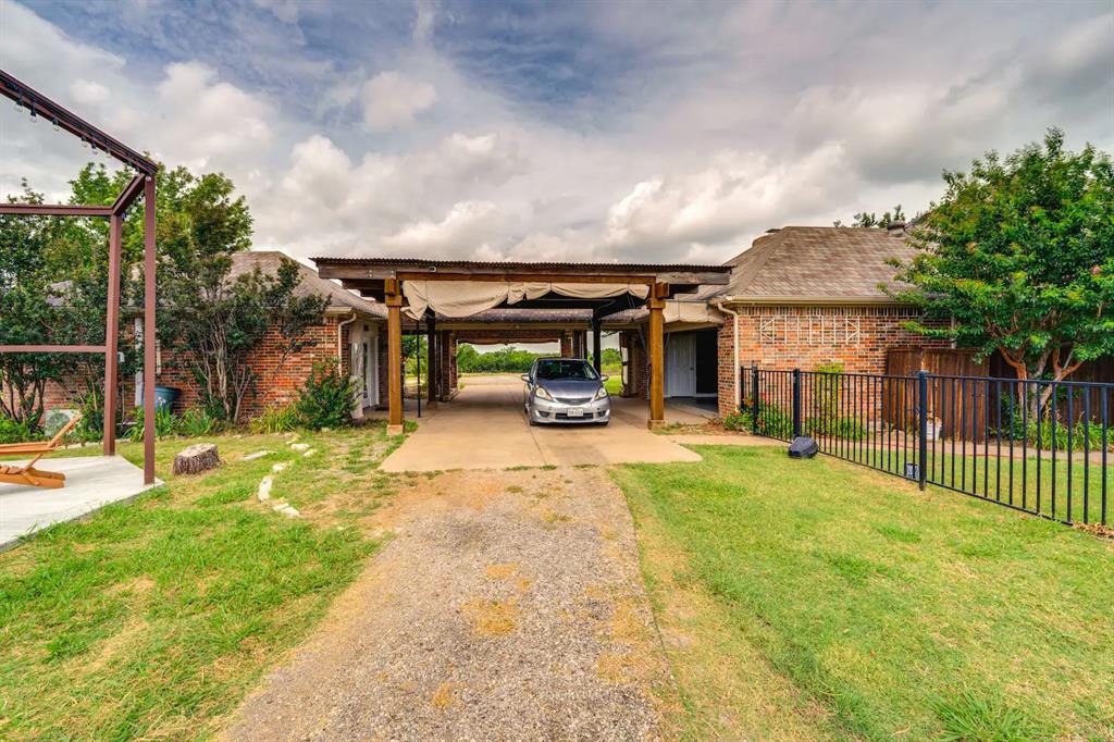 2045 Weston Road McKinney, TX 75071 - Photo 31 of 40 a view of a house with backyard and porch