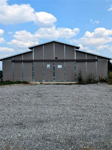 a front view of house with yard and barbeque oven
