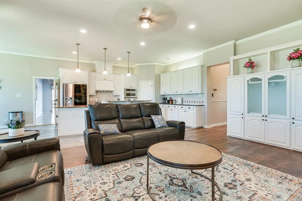 2045 Weston Road McKinney, TX 75071 - Photo 5 of 40 a living room with furniture and kitchen view