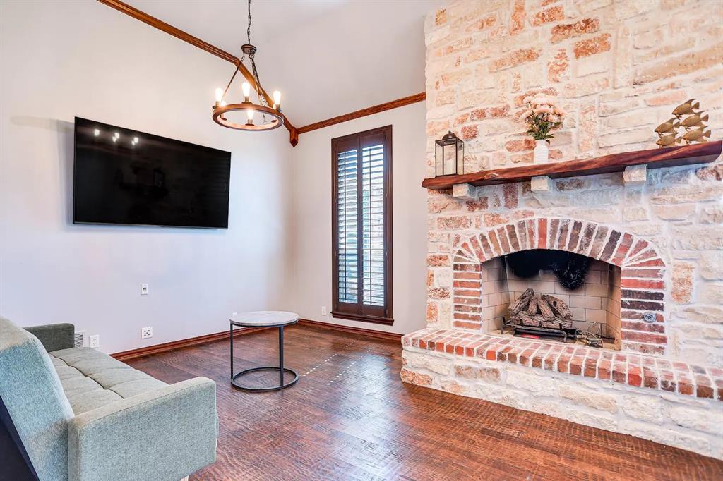2045 Weston Road McKinney, TX 75071 - Photo 6 of 40 a living room with furniture and a fireplace