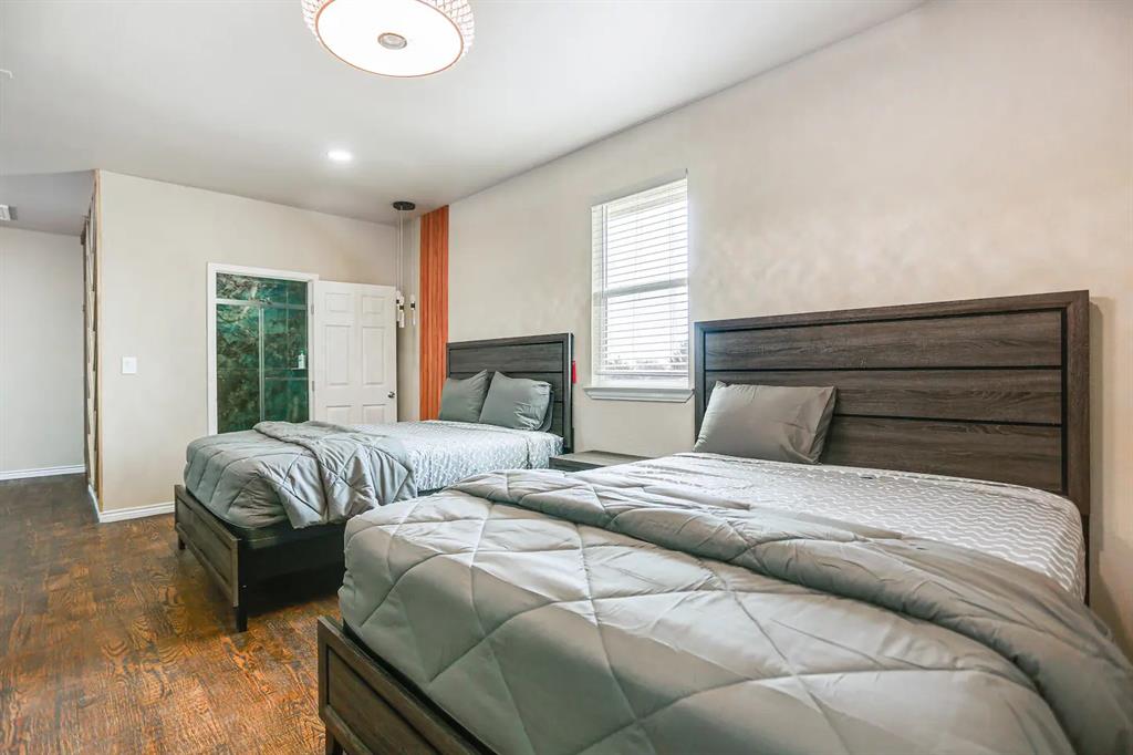 2045 Weston Road McKinney, TX 75071 - Photo 8 of 40 a bedroom with double bed and a large window