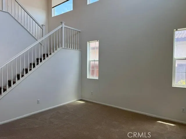 a view of an empty room with stairs