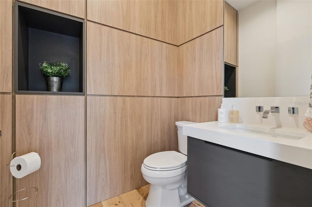 908 Croton Road Celebration, FL 34747 - Photo 28 of 86 a bathroom with a sink a toilet and shower